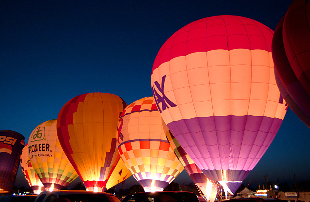 A group of hot air balloons in the sky.