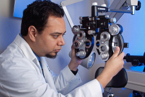 An eye doctor using an eye examining machine