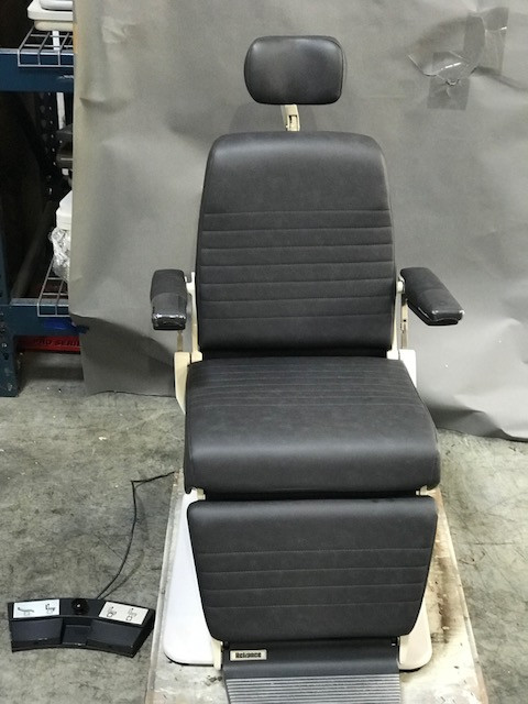 Black adjustable chair with headrest and footrest. Black adjustable chair with headrest and footrest.