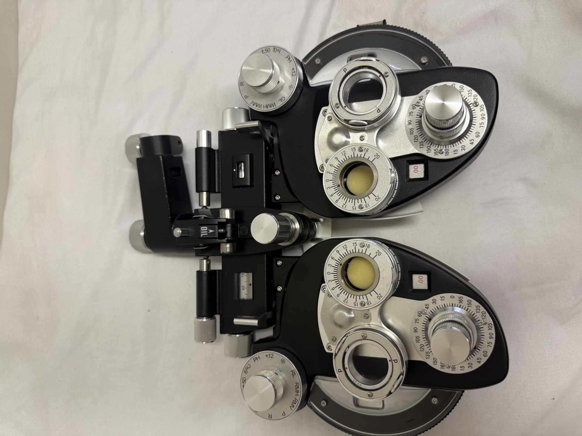 Optometry phoropter on white background.