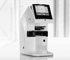 Modern digital eye testing machine on table.